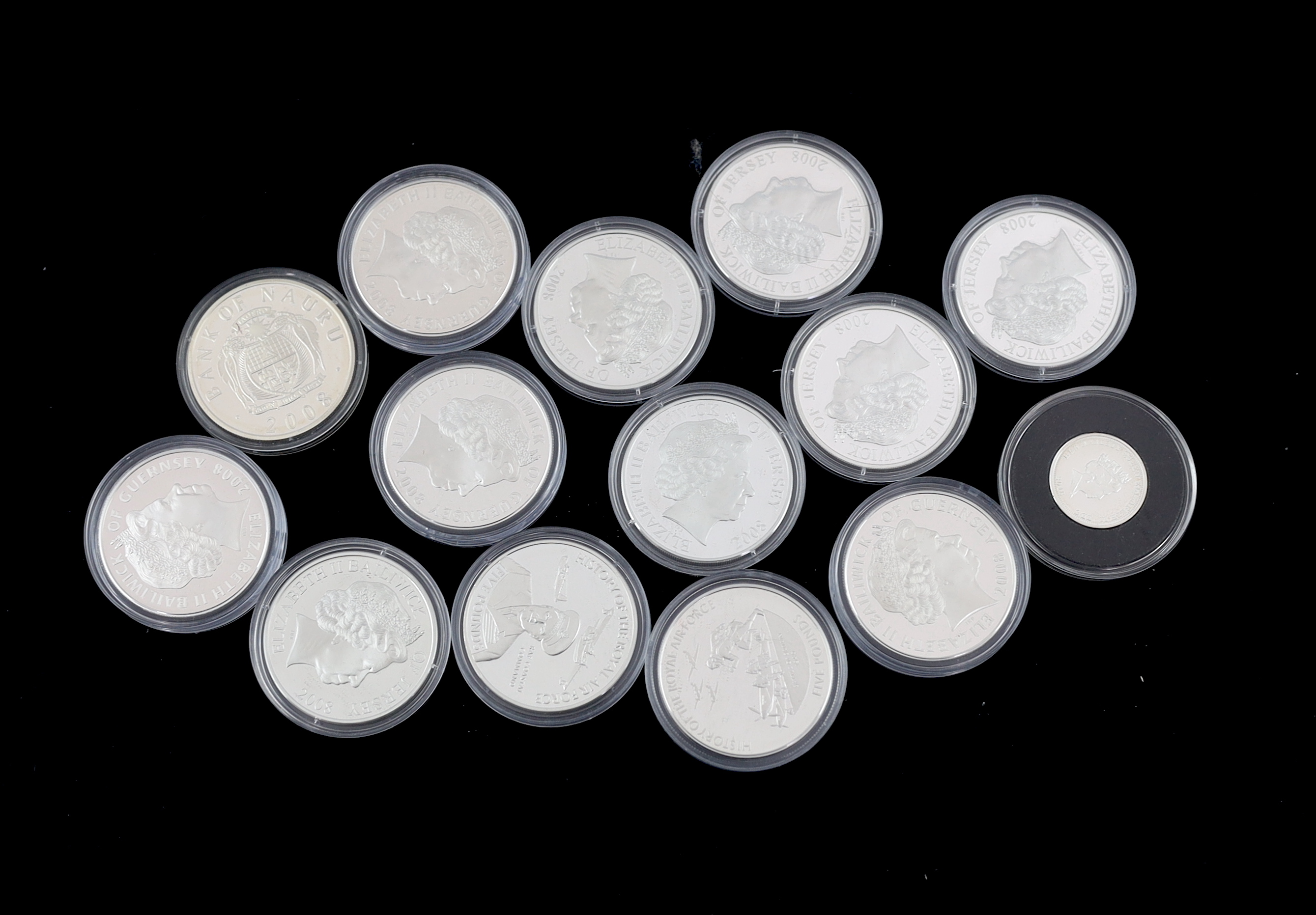 Bailiwick of Jersey and Guernsey coins, Elizabeth II, 13 History of the RAF proof silver £5 coins, 2008, a similar cupronickel coin and a Tristan da Cunha proof silver 80th anniversary Spitfire £1 coin (15)